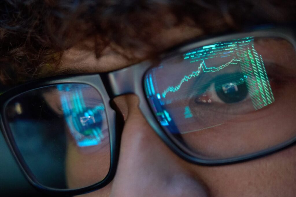On Watch: 2 Canadian Stocks That Could Destroy a $100K Portfolio a person watches stock market trades